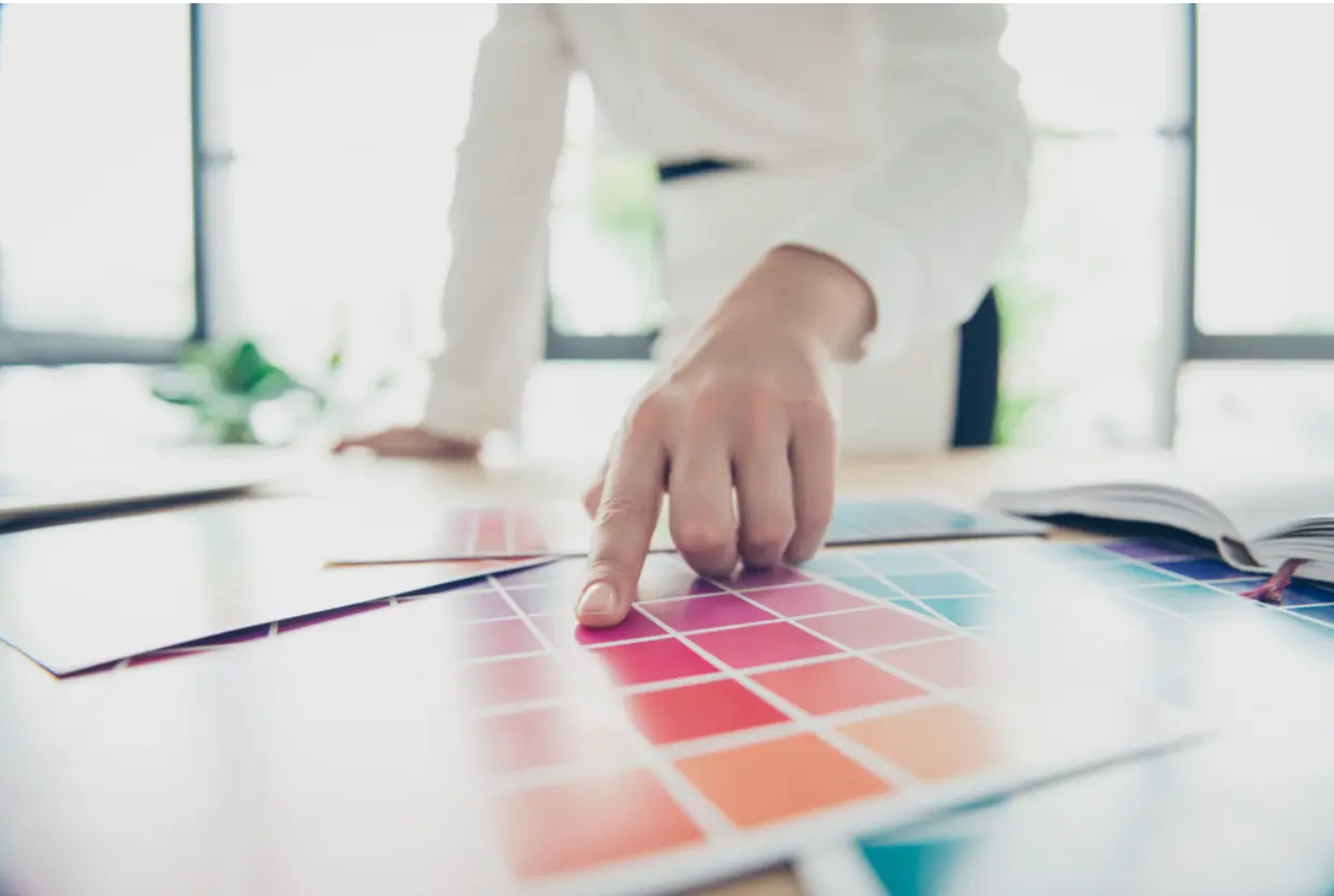 Person choosing a color palette
