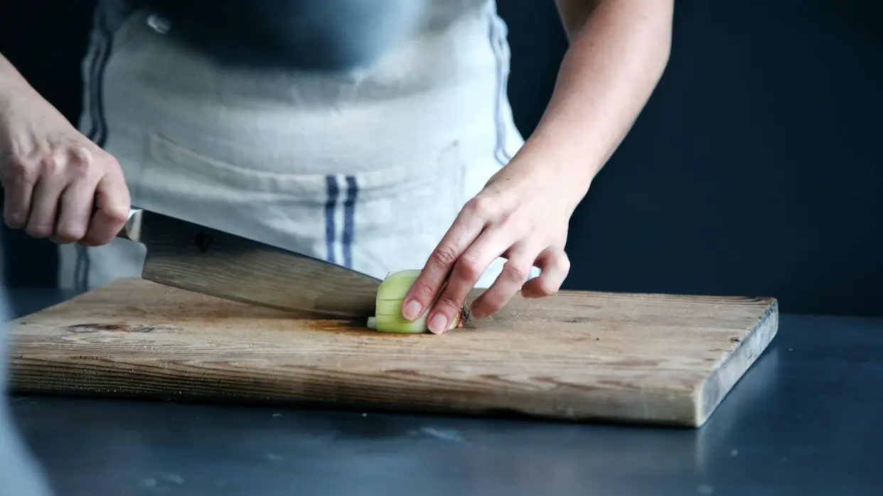 Chef cutting vegetable