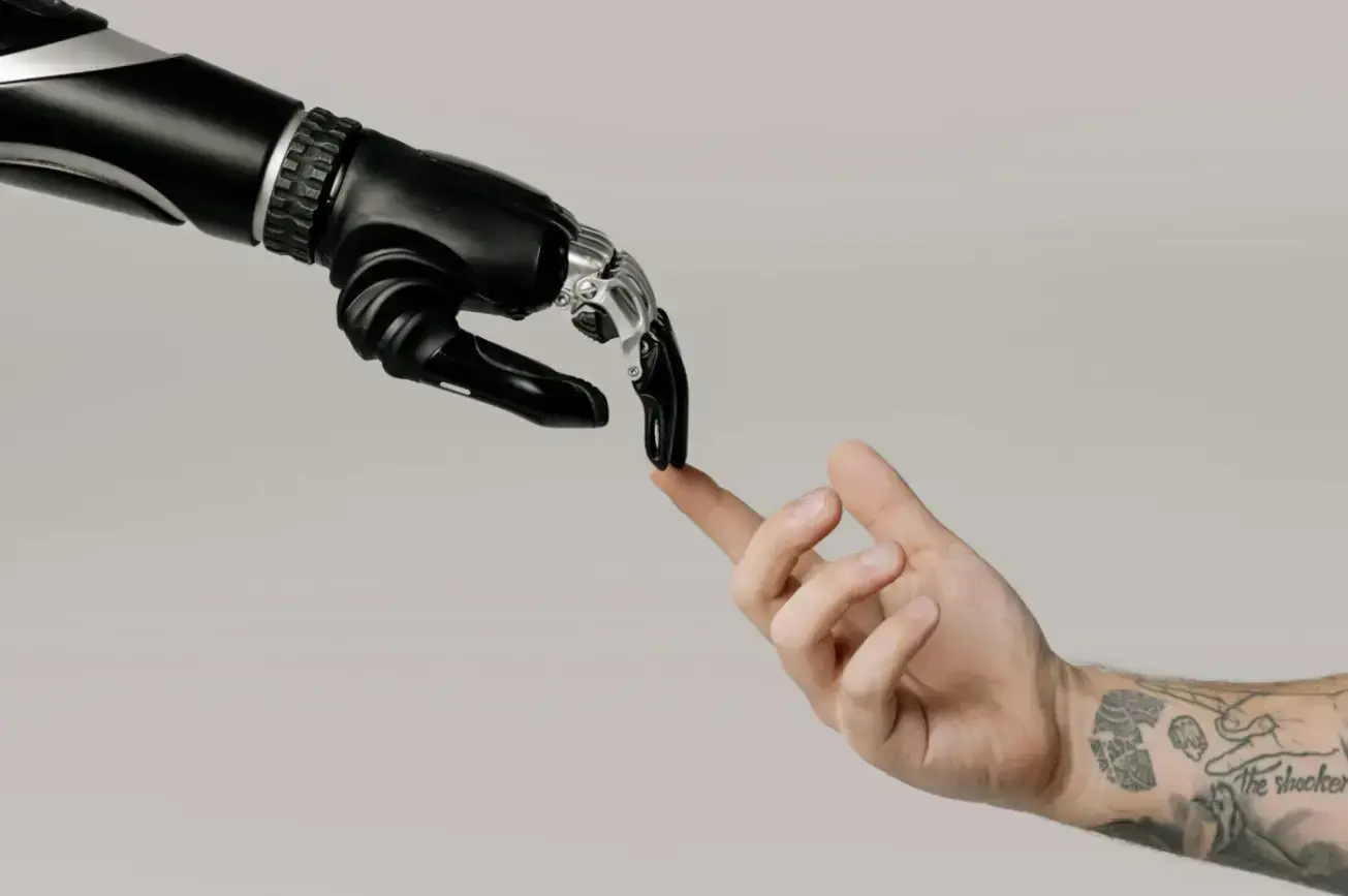 bionic-hand-and-human-hand-finger-pointing