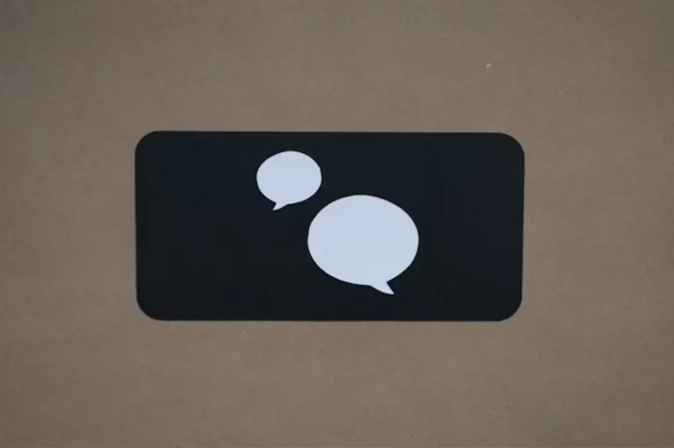 black-square-with-a-white-speech-bubble-on-it