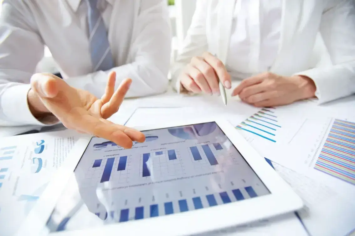 businessmen-reviewing-data-analytics