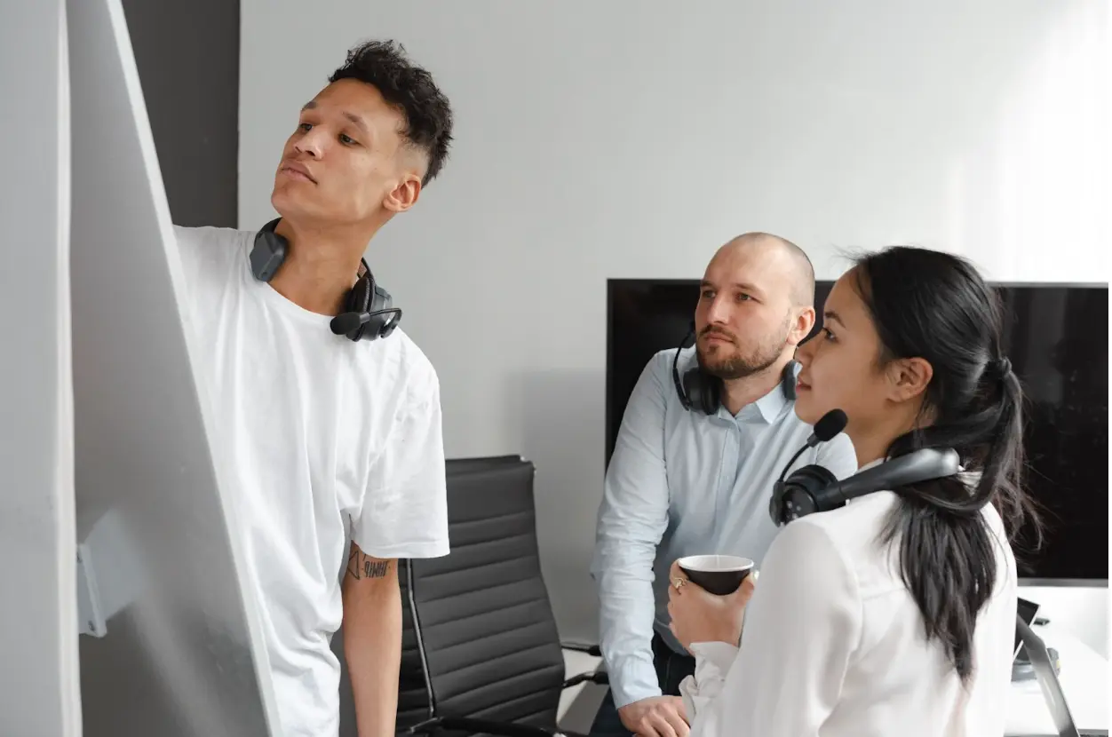 colleagues working together using a board