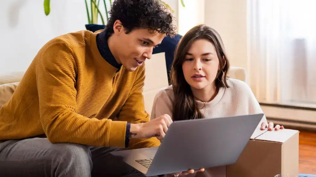 couple-looking-at-laptop