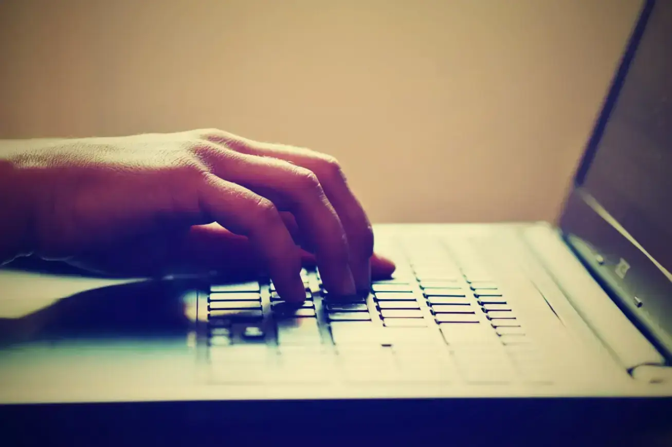 crop-person-using-laptop