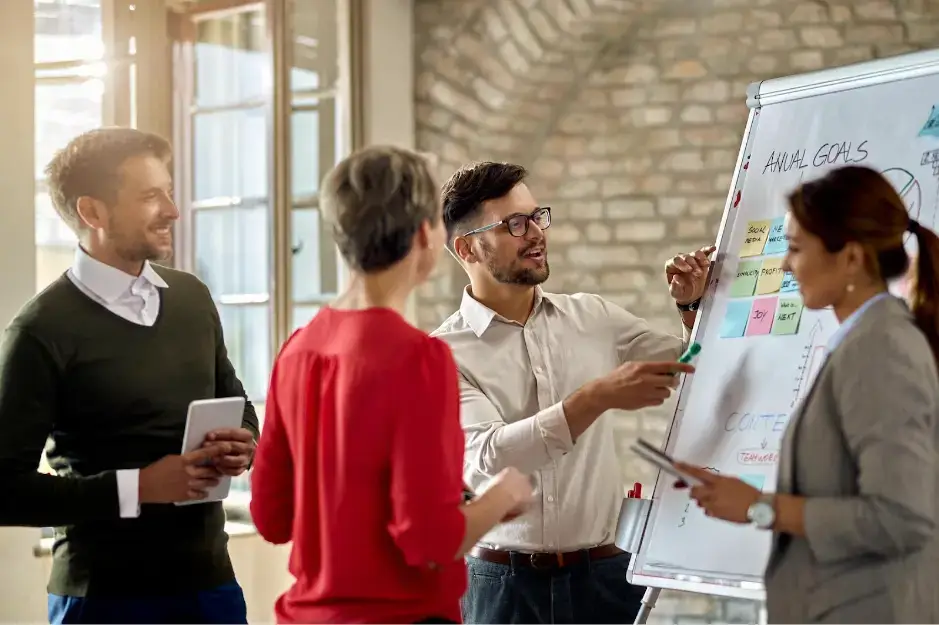 employees-putting-sticky-notes-on-the-board