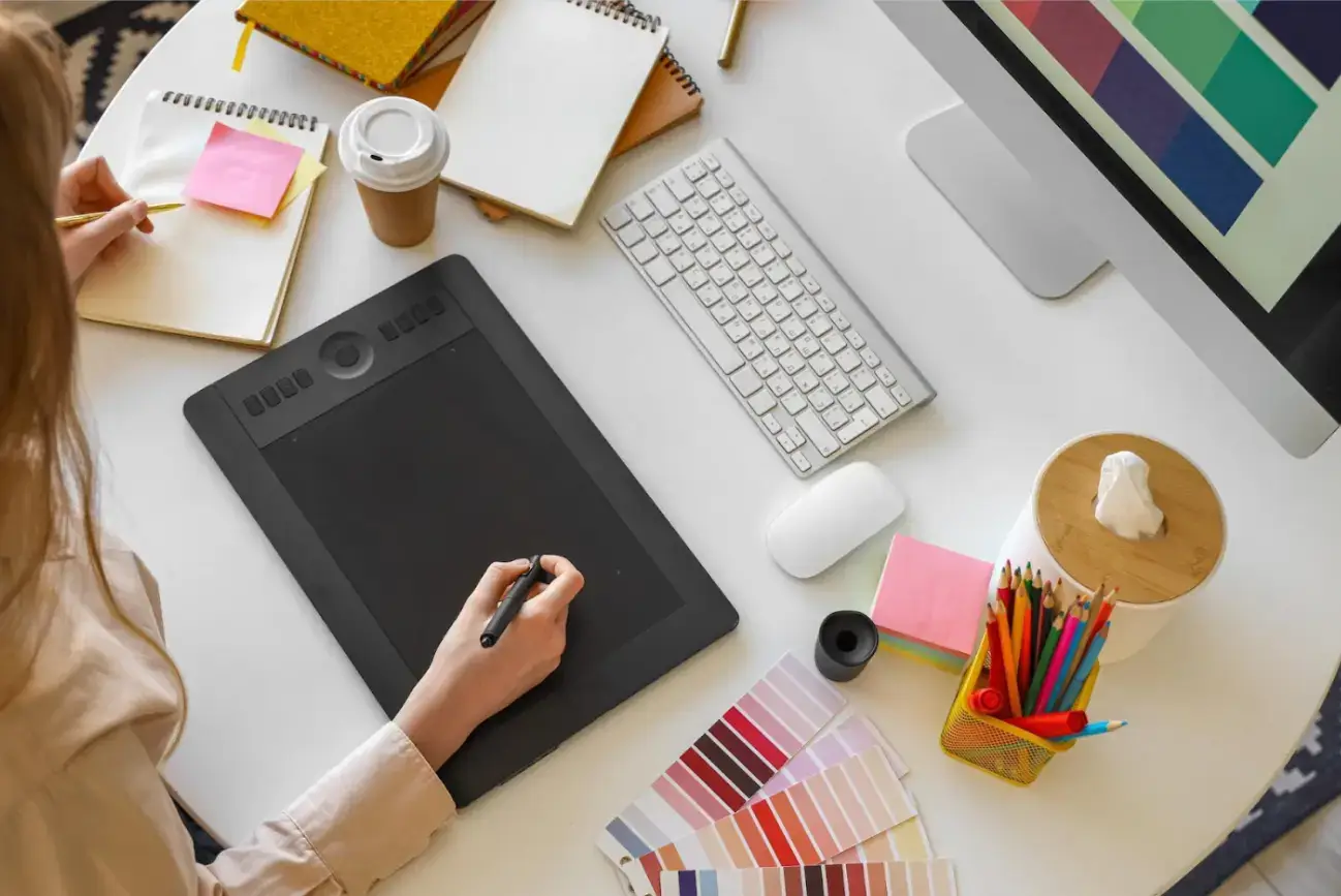 female-graphic-designer-working-with-tablet-at-table-in-office