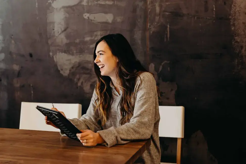 girl-laughing-while-in-a-meeting