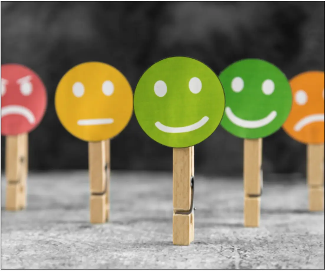 happy and sad cardboard faces