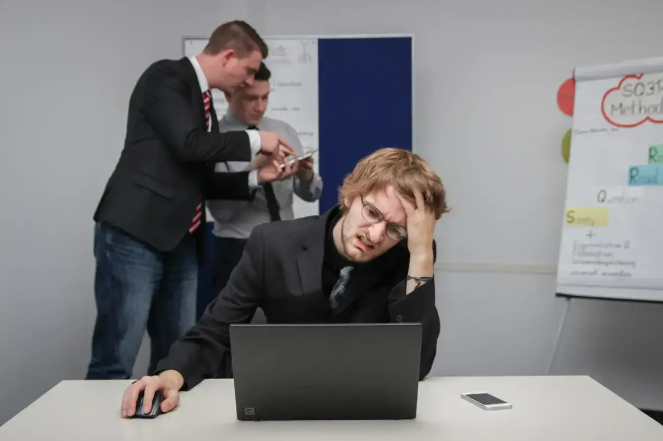 man-sitting-in-front-of-a-laptop-computer