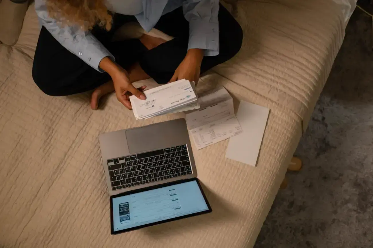 overhead-shot-of-a-woman-holding-a-cheque