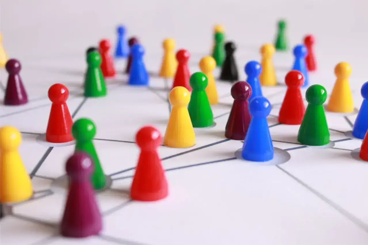 people-figurines-on-white-paper