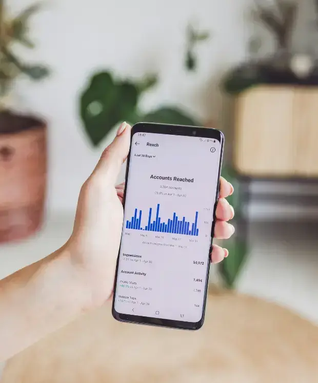 person-holding-a-cell-phone-in-their-hand