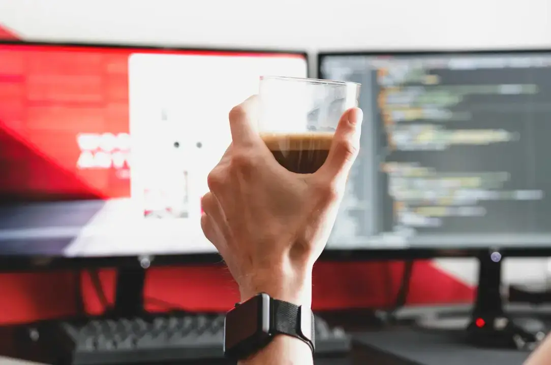 person-raising-a-glass-in-a-toast