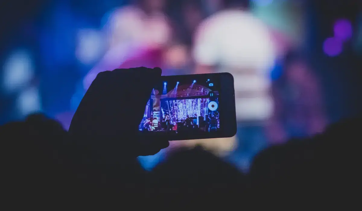 person-videoing-concert