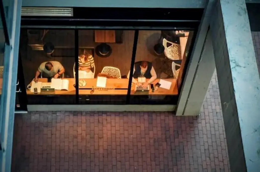 solopreneurs-working-into-the-night-in-coworking-space