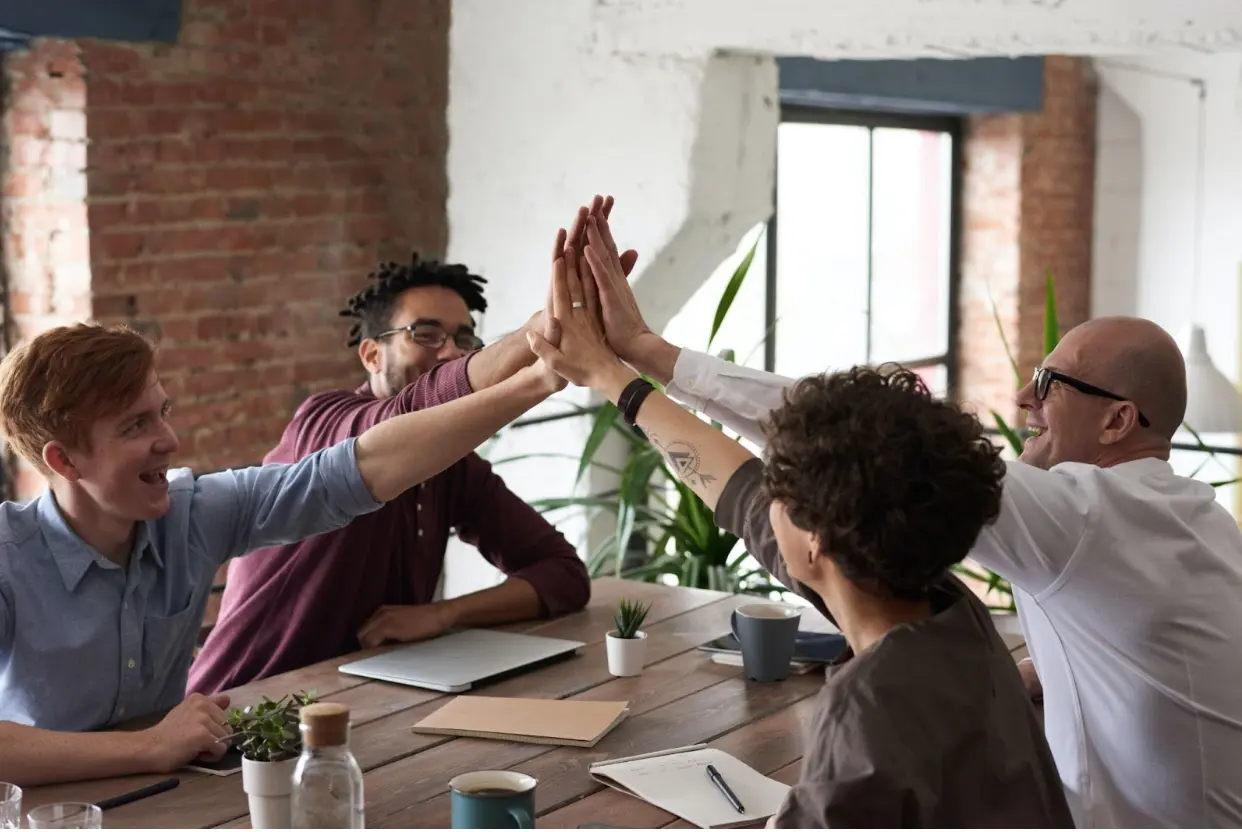 team doing a high five
