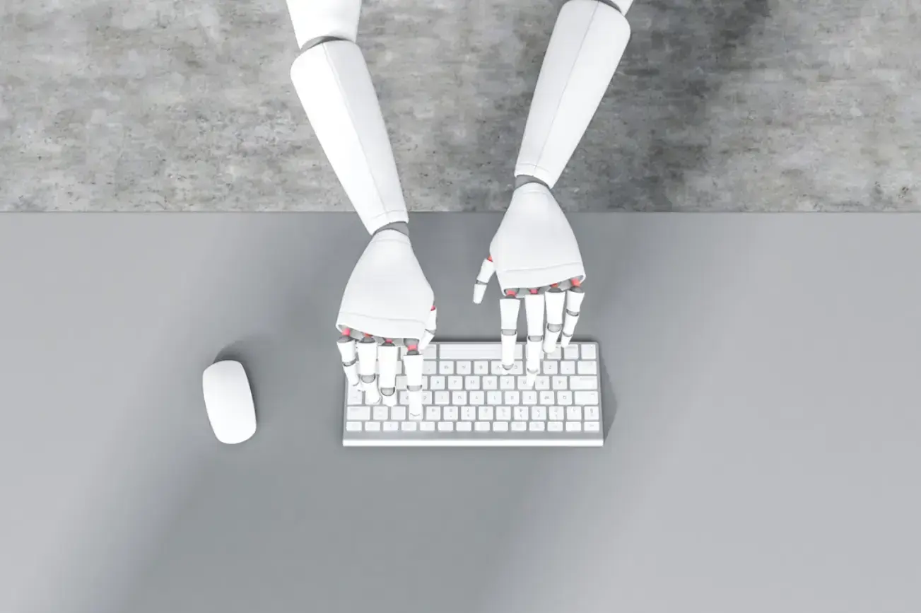 top-view-white-robot-hands-typing-keyboard