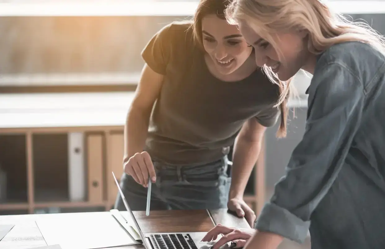 two-people-looking-at-laptop