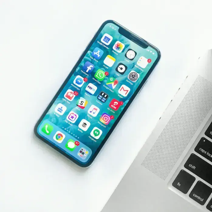 white-smartphone-near-laptop