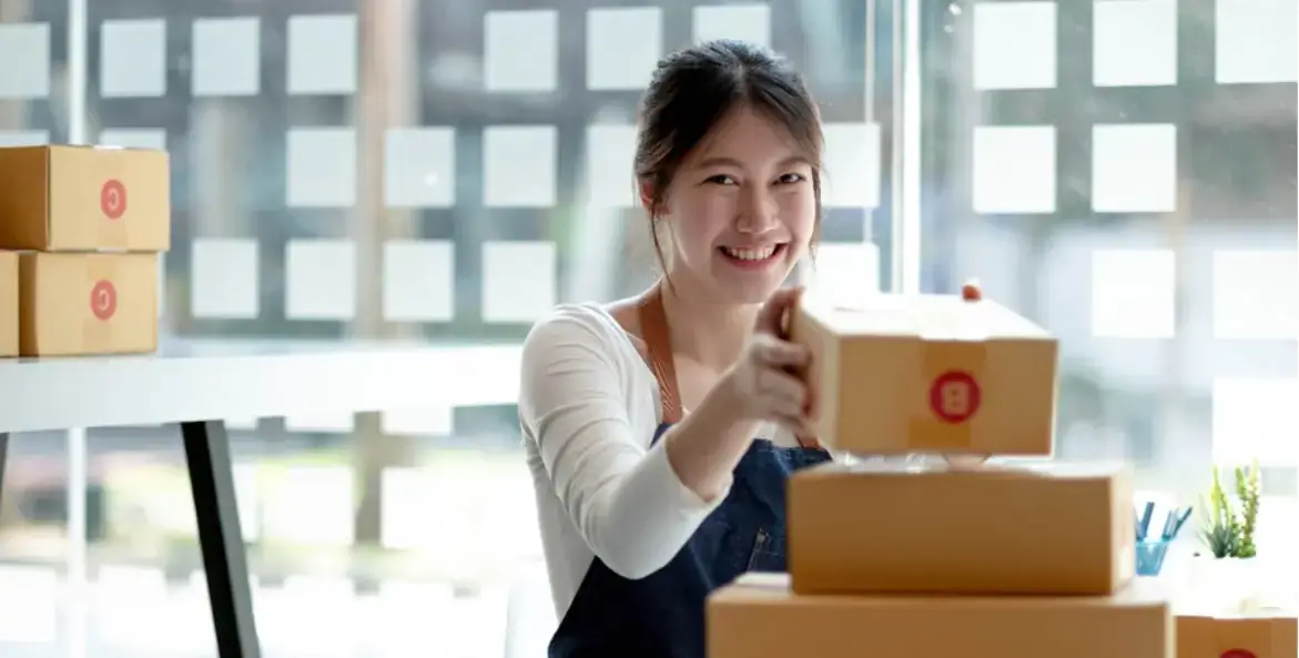 woman-placing-boxes-on-top-of-each-other