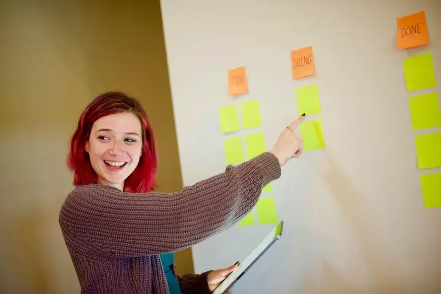 woman-pointing-at-whiteboard