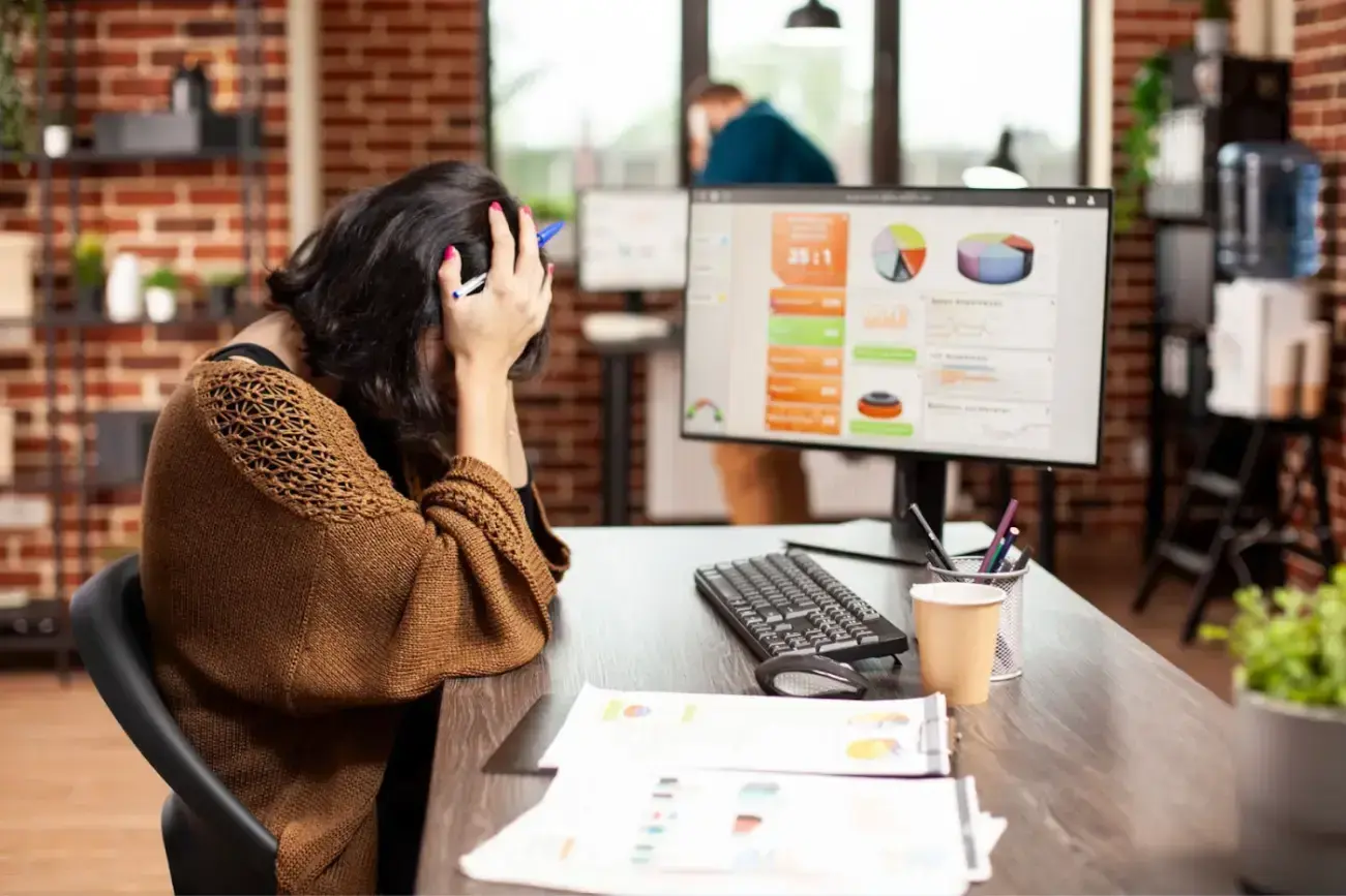 woman-resting-her-head-office-desk