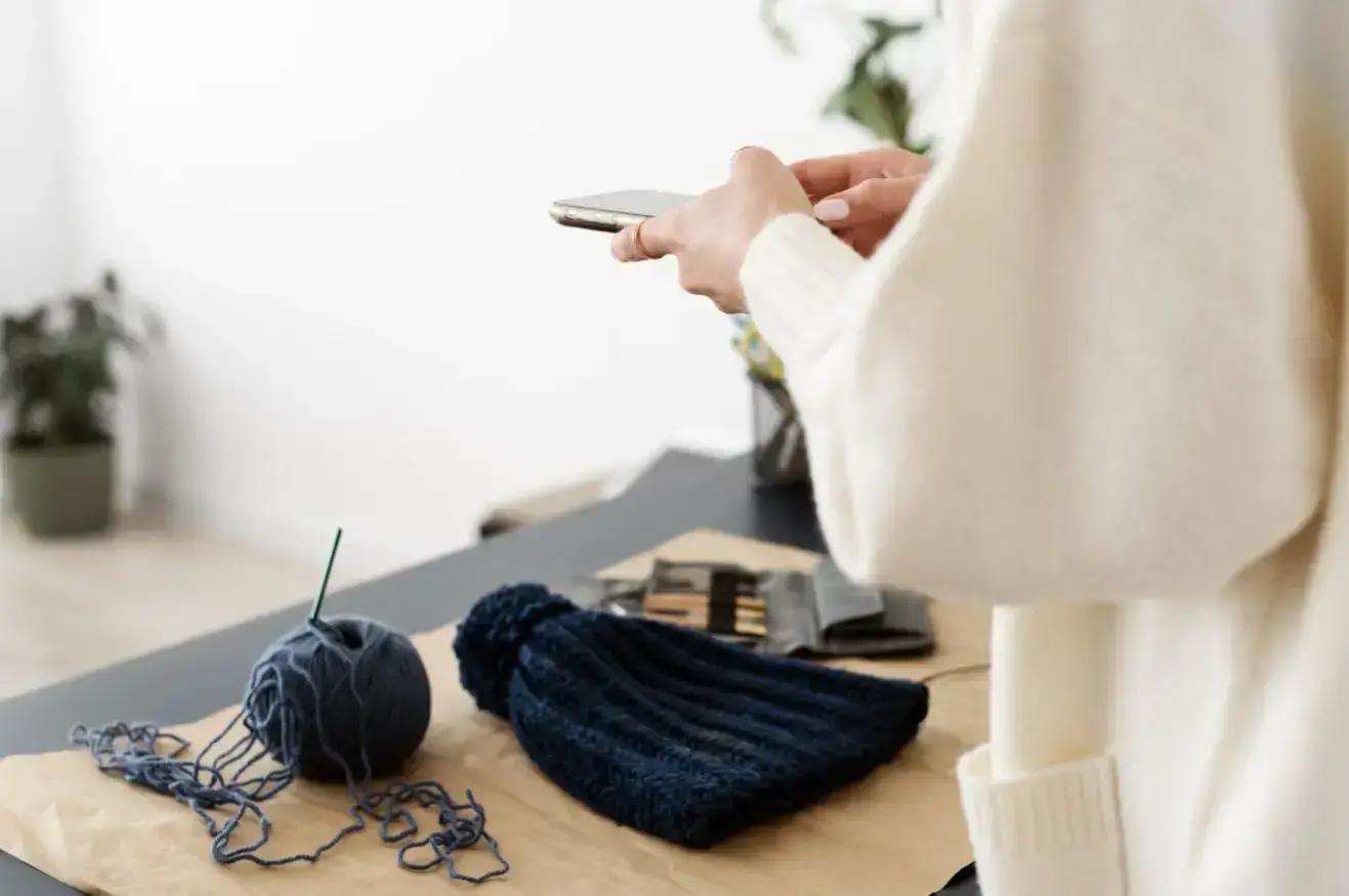 young-adult-taking-picture-their-knitting-product_